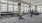 free weights and cardio machines in bright fitness center with large windows