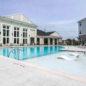 Pool tanning shelf with loungers in pool