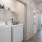 side-by-side washer/dryer units in lighted laundry closet